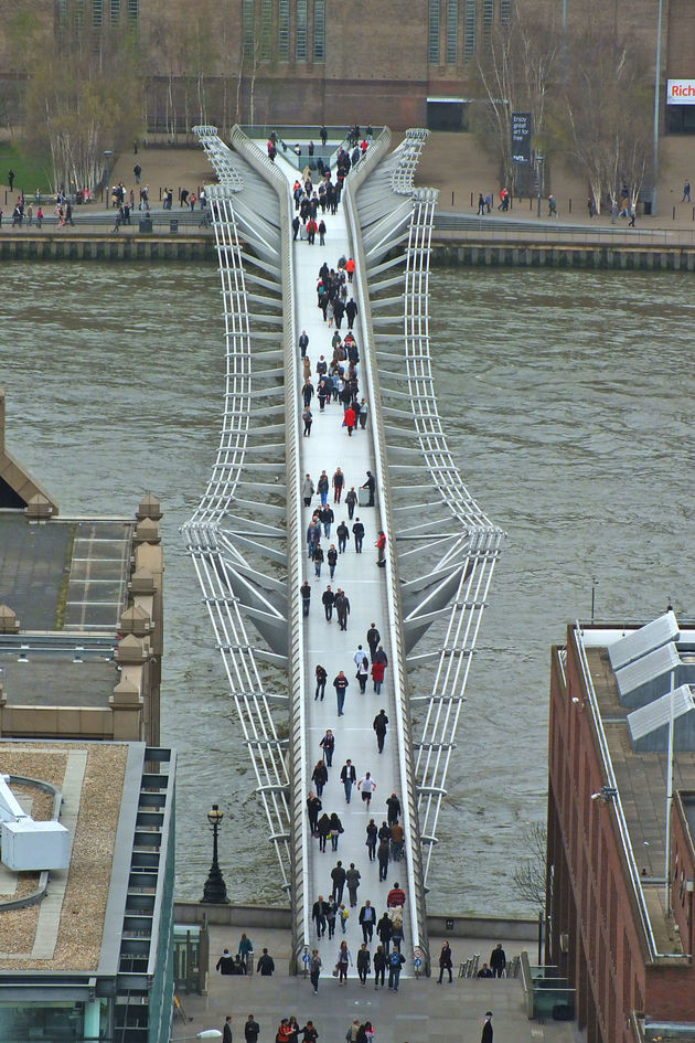 people crossing London Millenium bridge from St Pauls